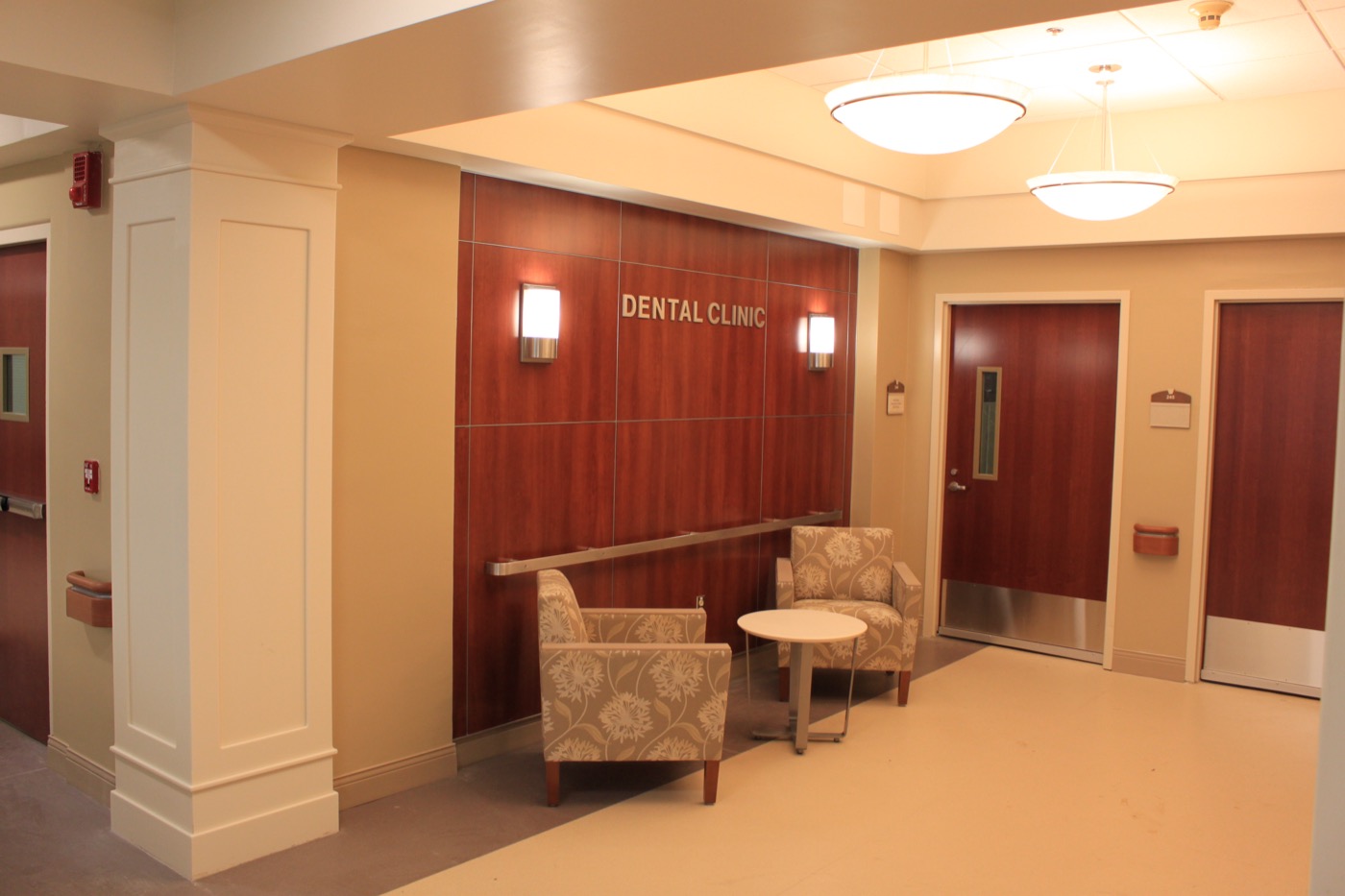 Dental clinic check-in counter with blue-lit signage