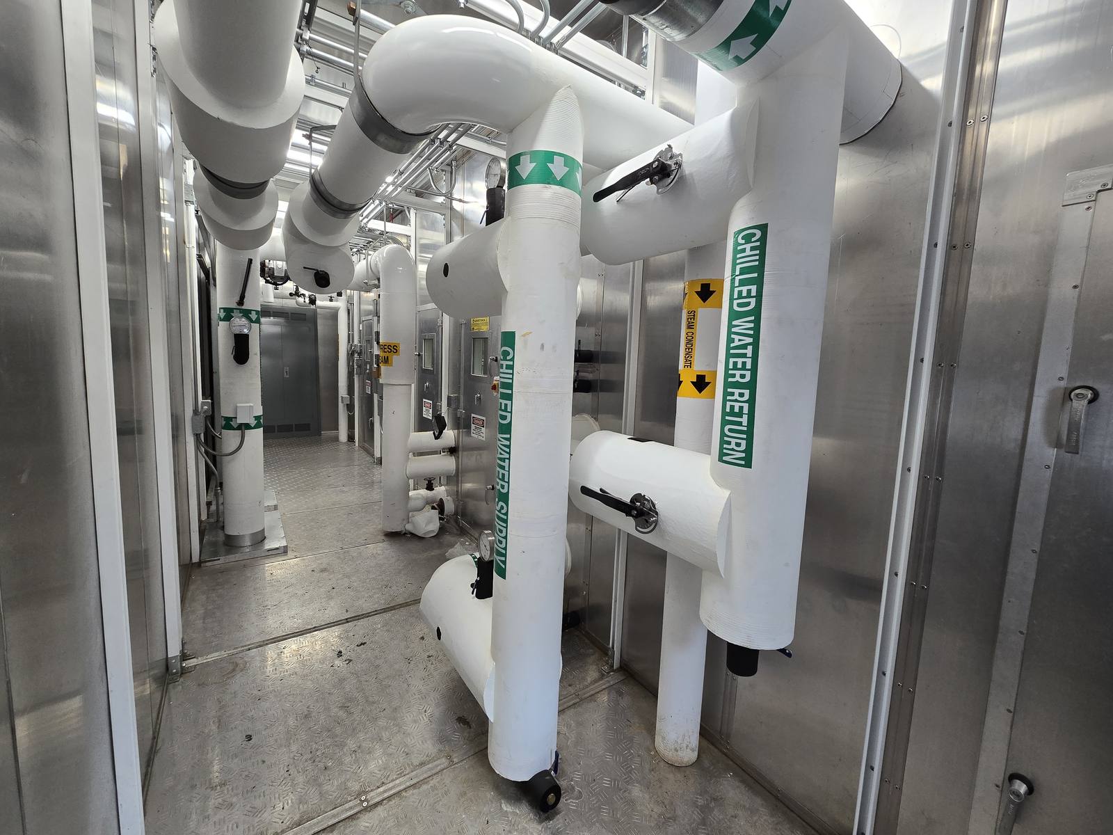 Labeled chilled water supply and return piping in the Asheville VA Medical Center mechanical plant