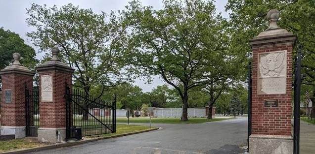Brick columns and iron gates at the relocated main entrance of Long Island National Cemetery